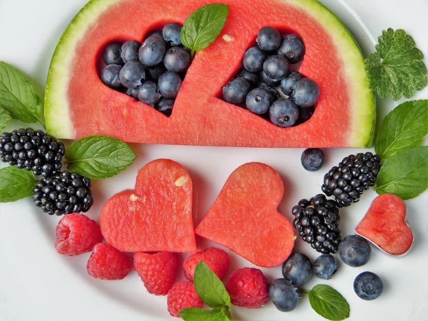 This watermelon slice, surrounded by blackberries, blueberries and raspberries are the textbook definition of health foods... and are delicious