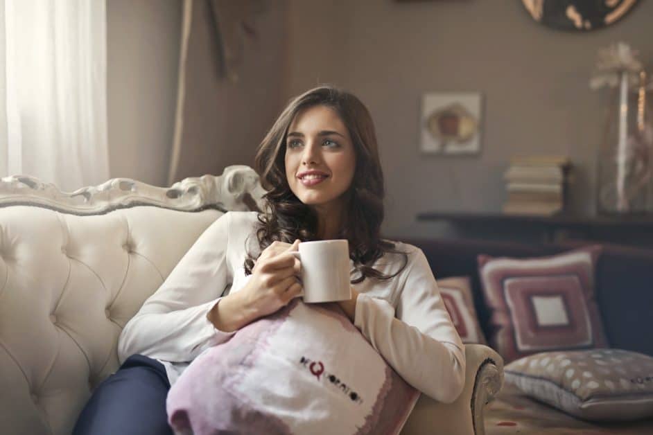 Do your nighttime routines involve cosying up on the sofa with a hot drink, like this woman? Why not?