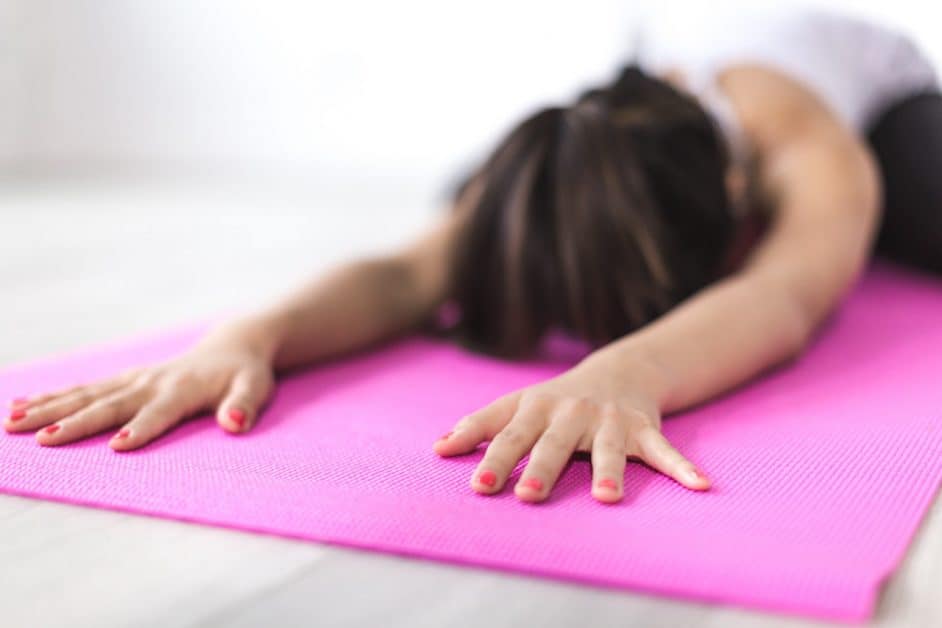 When it comes to her best meditation routine, this woman, in child's pose on a pink mat, clearly has the right idea.