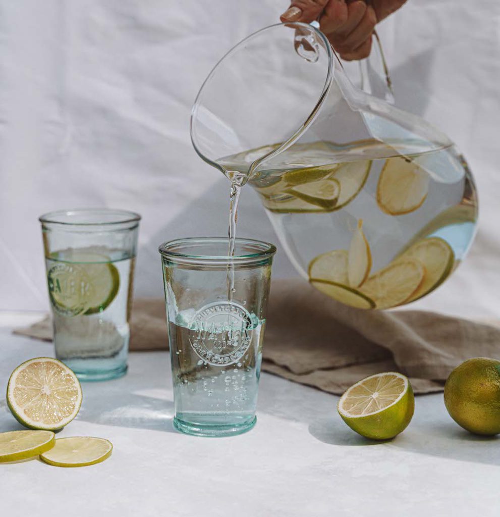 jug of water being poured in glasses