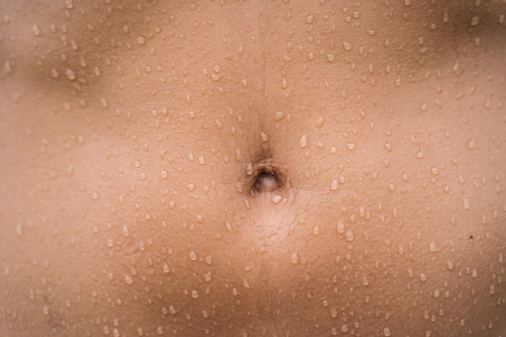 stomachs, like this very flat tanned one, suffer when you're bloating during period